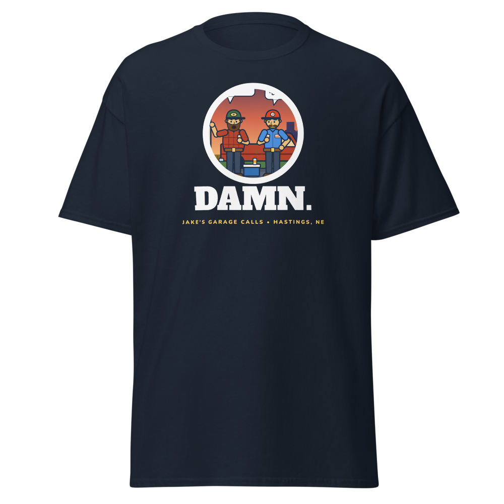 Navy tee with the garage-at-dusk scene in a round patch, DAMN. underneath